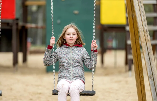 Cute Little Girl Riding Chain Swing Autumn Park — Stock Photo, Image