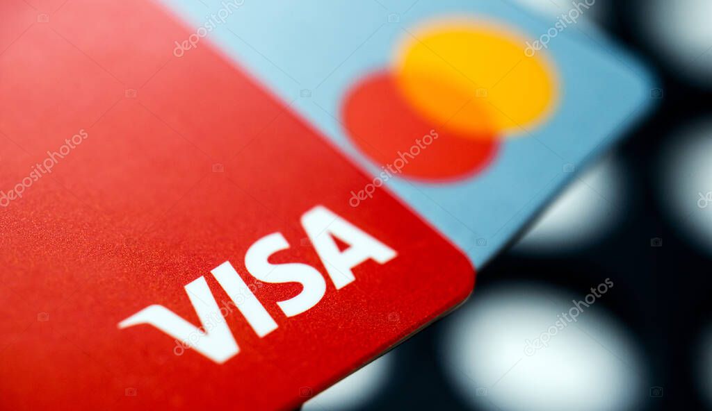 Kharkiv, Ukraine - May 06, 2022: Visa and Mastercard credit cards close up