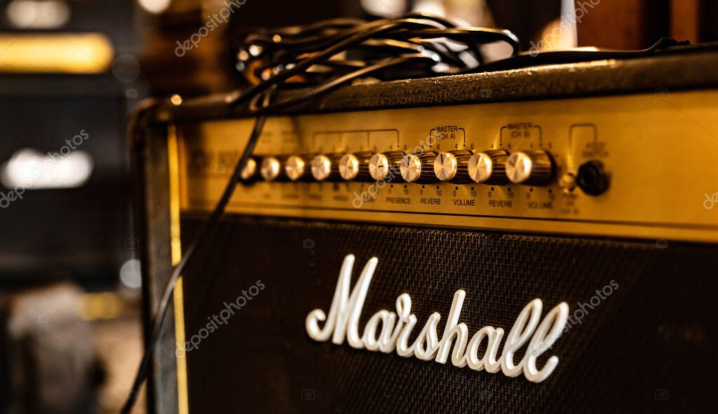 Kharkiv, Ukraine - March 11, 2022: Close up of a Marshall guitar amplifier with wires at the rehearsal base