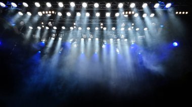 concert and show abstract atmospheric background with with a lot of spotlights lighting the stage clipart