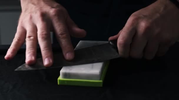 Close Male Hands Sharpening Kitchen Knife Whetstone Using Water Sharpening — Stock video