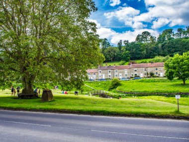 Hutton le Hole, North Yorkshire, England. looking across village green and beck clipart