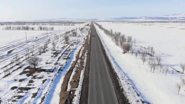 Movement Vehicles Road Winter Mountainous Terrain Fields Covered Snow Horizon — Stock Video