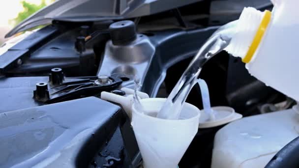 Closeup Pouring Deionized Water Car Tank Windshield Wipers — Stock Video