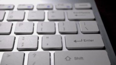 sliding footage of white keyboard of laptop closeup