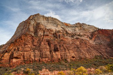 Zion Canyon at the base of Angel's Landing in the fall with changing trees and sunshine at Zion National Park, Utah.