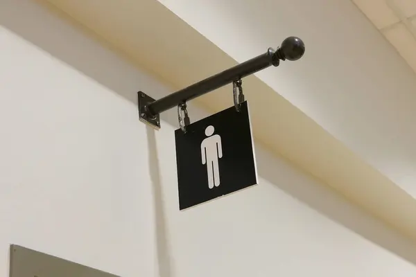 Ein Mann Waschraum Logo Der Wand Stockbild
