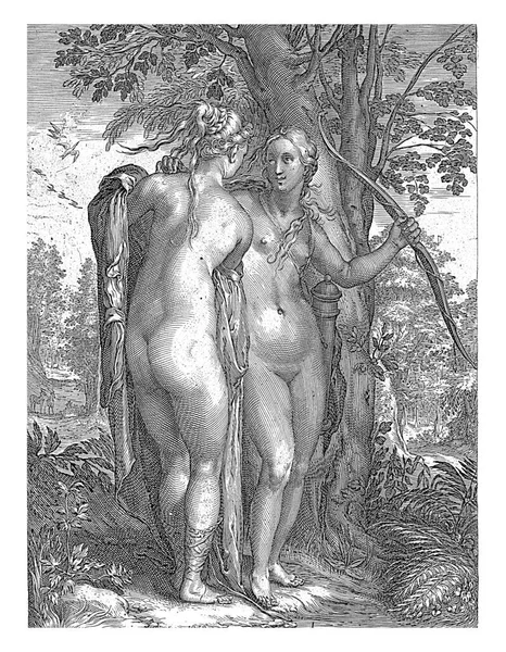 木の前には裸のダイアナ 弓と矢 と彼女の仲間の1人が立っています 印刷はダイアナと彼女のニンフの3部作の一部であり ラテン語のキャプションを持っています — ストック写真