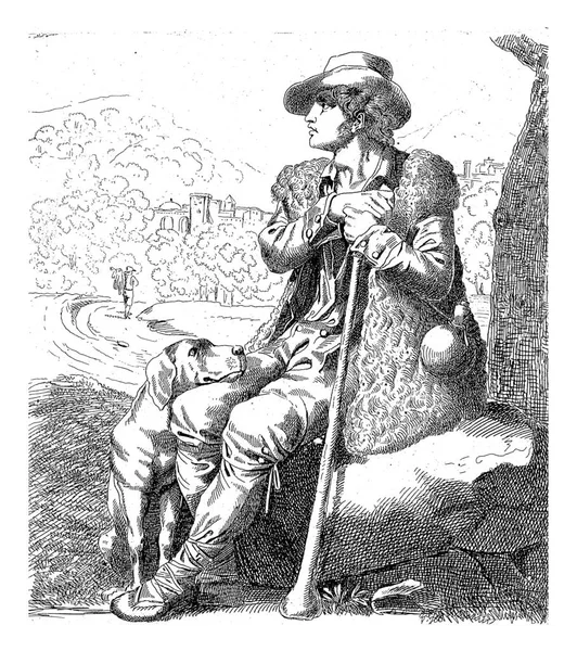 在风景中 一个披着羊皮的牧羊人坐在岩石上的一棵树下 牧羊人旁边坐着一只狗 它的头靠在年轻人的膝上 — 图库照片