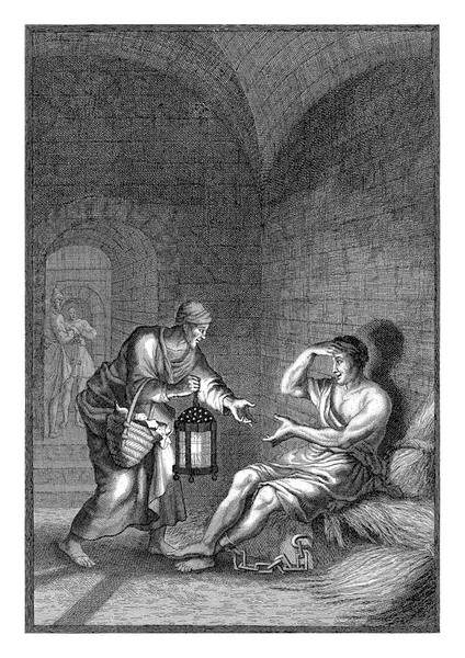 Man Brings Food Prisoner Prisoner Sits Stone Dark Room Fastened — Stock Photo, Image