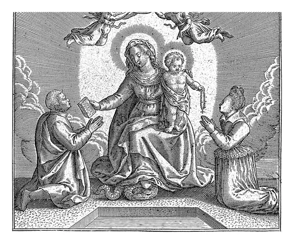 stock image Mary and the Christ Child are flanked by two kneeling donors; on the left a man to whom she hands a Bible and on the right a woman.