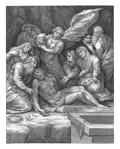 キリストの体は男性と女性によって追悼されています マリア マグダラのマリアの真ん中で彼女の軟膏の瓶で 前景にはとげの冠 十字架の釘 開いている石棺 — ストック写真