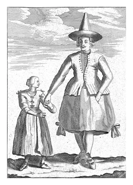 娘と一緒にグロニンゲンから来た農家 農家は尖った帽子とふわふわのスカートを着用し 女の子は弓でカーディガンを身に着けています — ストック写真