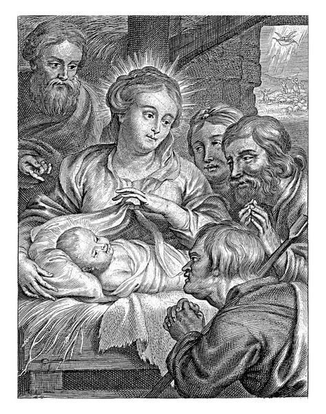 玛丽和约瑟夫给孩子们展示了三个牧羊人躺在马槽里的情景 — 图库照片