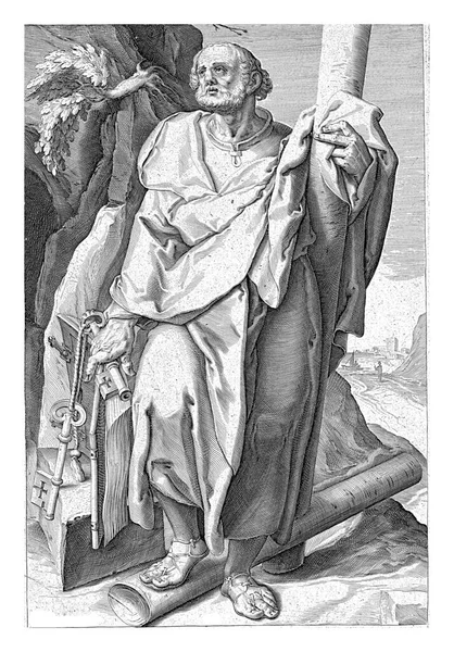 使徒ペテロは海岸近くの岩の多い環境に立っていて 鍵が2つ 右手に本が1つ 左手に十字架が1つ 左足が十字線の上に立っていました — ストック写真