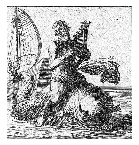 イルカに座っアリオンは 嘘を再生します 背後には彼が残した船がある — ストック写真