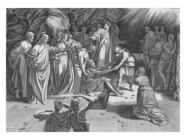 ある男と女が老ラザロを墓から救い出しました キリストが彼を呼ばれた後 ラザロは生き返らされました — ストック写真