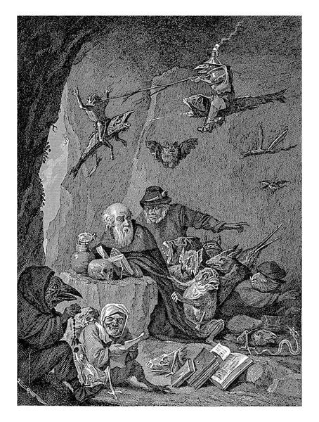 聖アンソニーは洞窟で祈るためにひざまずいている 目の前の岩の上に本と頭蓋骨が横たわっている 彼の周りを飛ぶ 歩くと素晴らしい形の動物や動物の手足を持つ人々の形で悪魔に座る — ストック写真