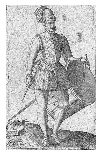 16世紀の衣服に身を包んだ兵士タンバー 右側のプロフィール 左手に太鼓を持ち 脇に剣を持っている — ストック写真