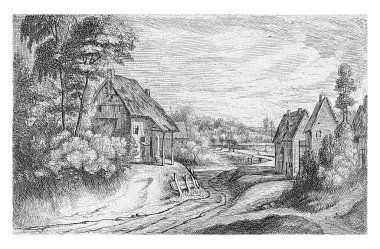 İki çiftlik arasında bir köy yolu.