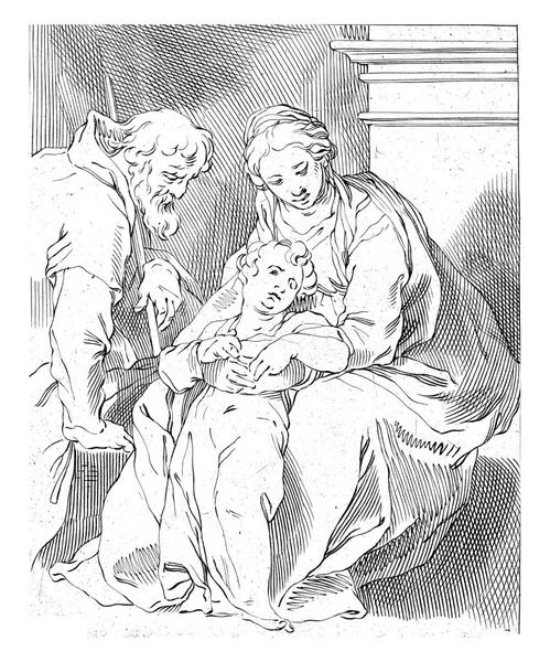 聖ヨセフは座っているマリアと幼い子供の隣でひざまずきます — ストック写真