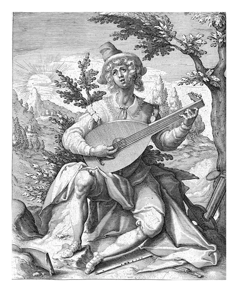 若い男 音楽家 の形でのサングインの気質の描写 ルートを演奏 音楽の本 フルートと日の出の美しい風景の中に彼の足で弓 — ストック写真