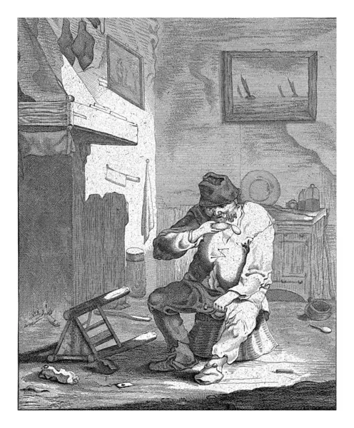 スヌフの箱を持つ男 アブラハム ブルイス アンドリーズの後 1679 1717 ラッグされた男は内部のスツールの上に座って スヌーフの箱の匂い — ストック写真