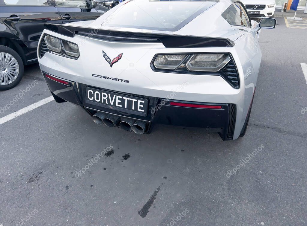 Sankt-Petersburg, Russia, October 29, 2022: Chevrolet Corvette C7 Z06 at a dealership store. Chevrolet Corvette logo.