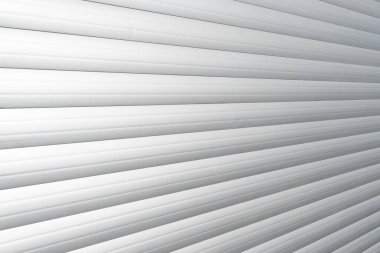 Roller shutter gate. Metal roller garage door as background. Automatic electric roll-up garage gate. Garage with rolling gates.