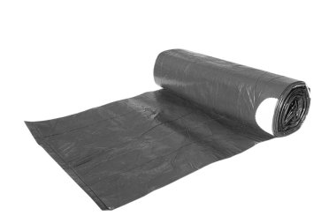 Black recycle rolls of garbage bin bags isolated on white background with copy space. Roll of garbage bags close-up