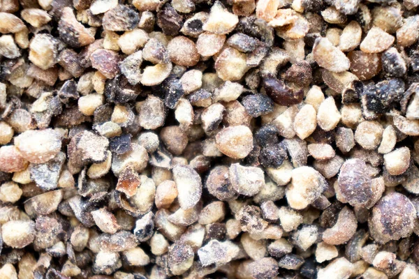 Macro shot dried ground pepper mix texture background. Macro shot. Texture of spices mix close-up. Black Pepper, Red and White pepper mix.