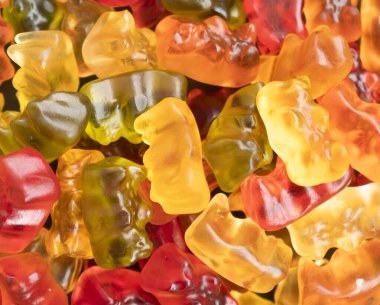 Macro shot assorted colorful gummy candies. Top view candy pattern. Jelly bears background texture. 