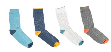 Four socks with different lines isolated on white background. Colorful sock son white background. Colored socks on the leg isolated on white background