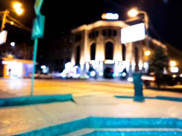 Homályos Háttér Éjszakai Város Épületek Elmosódott Sziluettje Világító Lámpák Bokeh — Stock Fotó