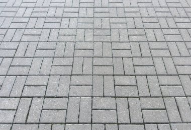 İdeal fayanslar. Döşeme kaplamalarının kapanışı. Sokak kaldırım levhaları. Yolun çimento bloğu. Beton tuğla kare taş zemin.