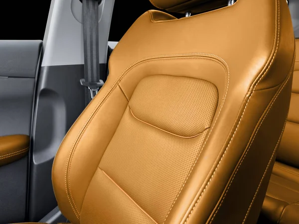 Black luxury modern car Interior. Detail of modern car interior. Part of black leather seats with red stitching in expensive car