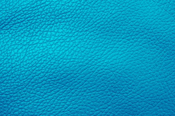 Macro shot blue leather texture background.. Part of perforated leather details. Blue perforated leather texture background. Texture, artificial leather