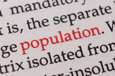 Kırmızı kelime nüfusuna odaklan. Makro çekim kırmızı renkli kelime Nüfus bir parça kağıt ya da kitap üzerinde