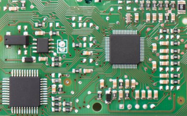 Circuit board with resistors microchips and electronic components background. Computer hardware technology. Integrated communication processor.	