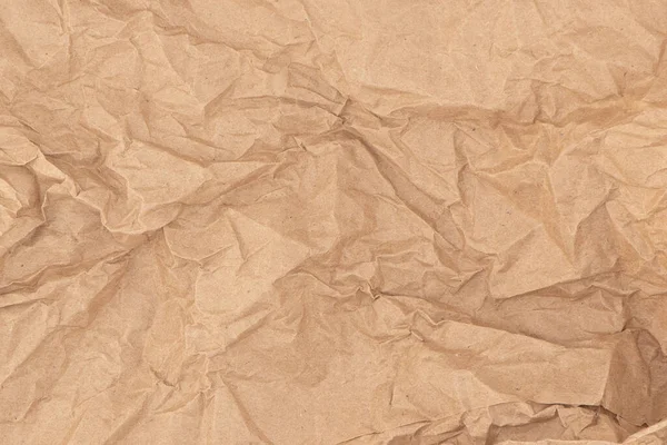 Crumpled paper brown background. Old paper background. Old crumpled vintage paper surface. Paper pattern