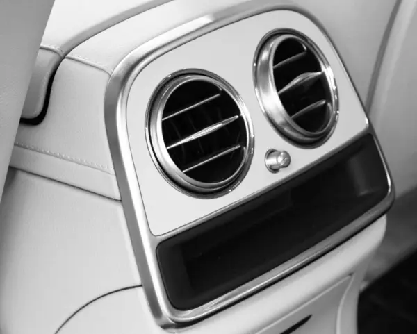 AC Ventilation Deck Luxury Car Interior. Modern car interior details white leather.  Car detailing.