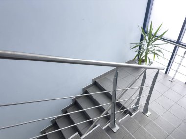 Modern stairs in loft interior. Interior with stairs. Straight staircase with railings