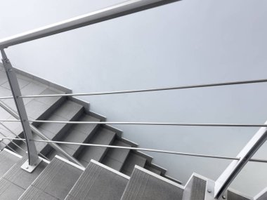 Modern stairs in loft interior. Interior with stairs. Straight staircase with railings
