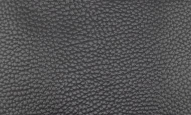 Deri döşeme arka planı. Delikli siyah deri detaylarının bir parçası. Deri dokusu delinmiş. Doku derisi