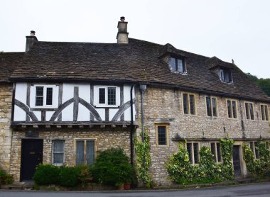 An old fachwerk house in the Castle Combe village, Cotswold, Wiltshire, UK clipart