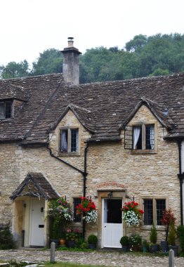 Traditional stone cottage in picturesque Castle Combe village, Costwolds, Wiltshire, UK clipart