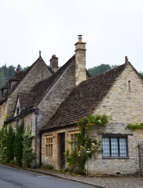 Traditional stone cottage in picturesque Castle Combe village, Costwolds, Wiltshire, UK clipart