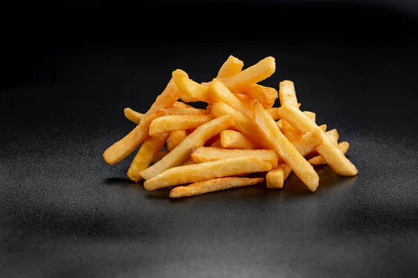 Pile French Fries Black Background Photo Menu — Zdjęcie stockowe