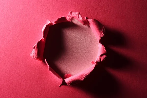Rózsaszín Papír Háttér Lyukkal Közepén — Stock Fotó