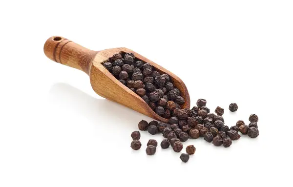 stock image Black pepper in wooden spoon isolated on white background